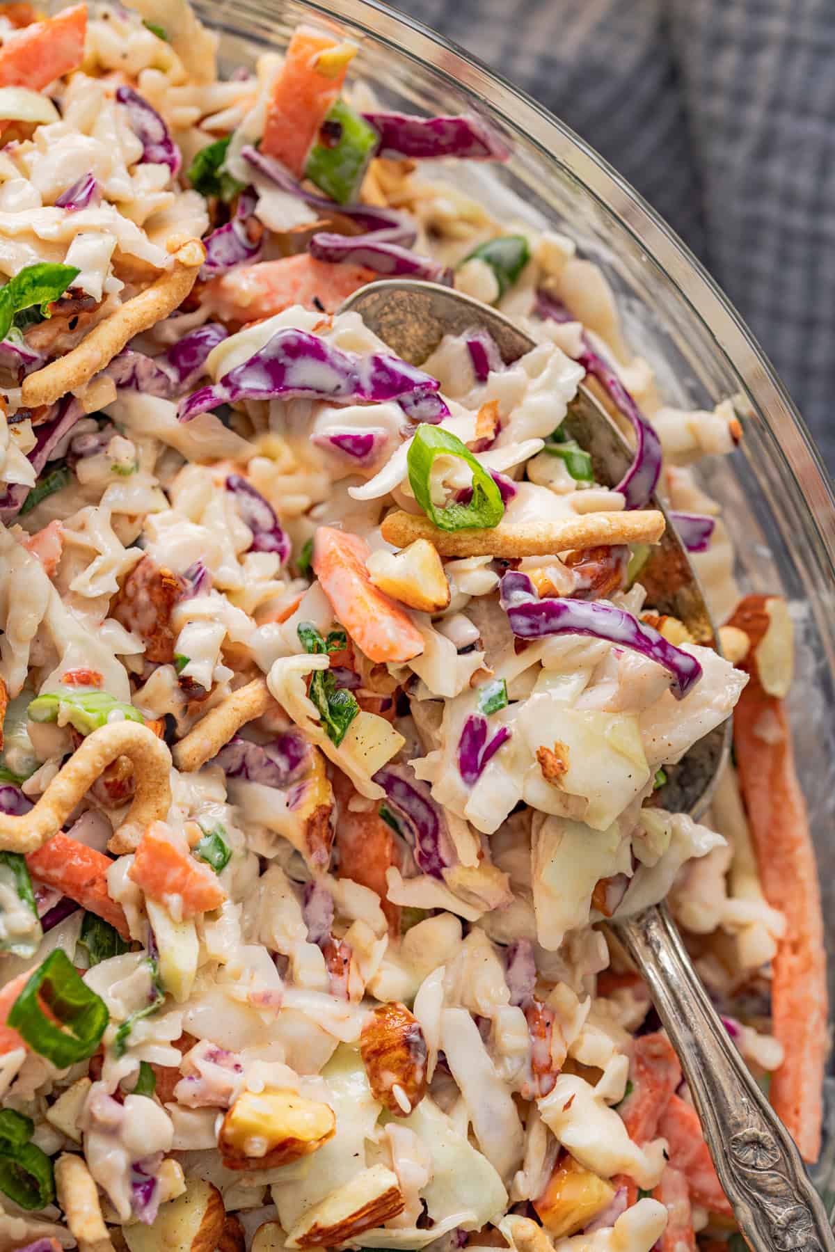 With ingredients like sweet chili sauce, ginger, and soy sauce, this Asian Coleslaw is not your basic coleslaw. Quick and easy! Close up of Asian coleslaw