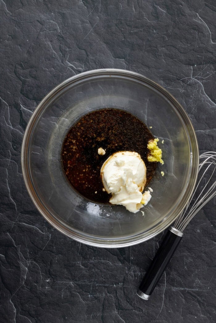 With ingredients like sweet chili sauce, ginger, and soy sauce, this Asian Coleslaw is not your basic coleslaw. Quick and easy! Whisking soy sauce, mayo, and other ingredinets