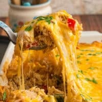 A spoon serving chicken fajita casserole