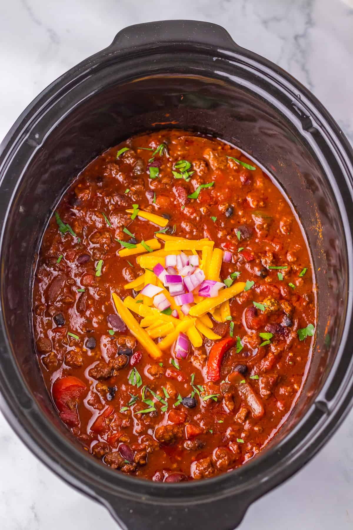 This sweet and tangy Dr. Pepper Chili is a delicious slow cooker recipe that’s perfect for a weeknight dinner. Dr. Pepper Chili cooked in slow cooker