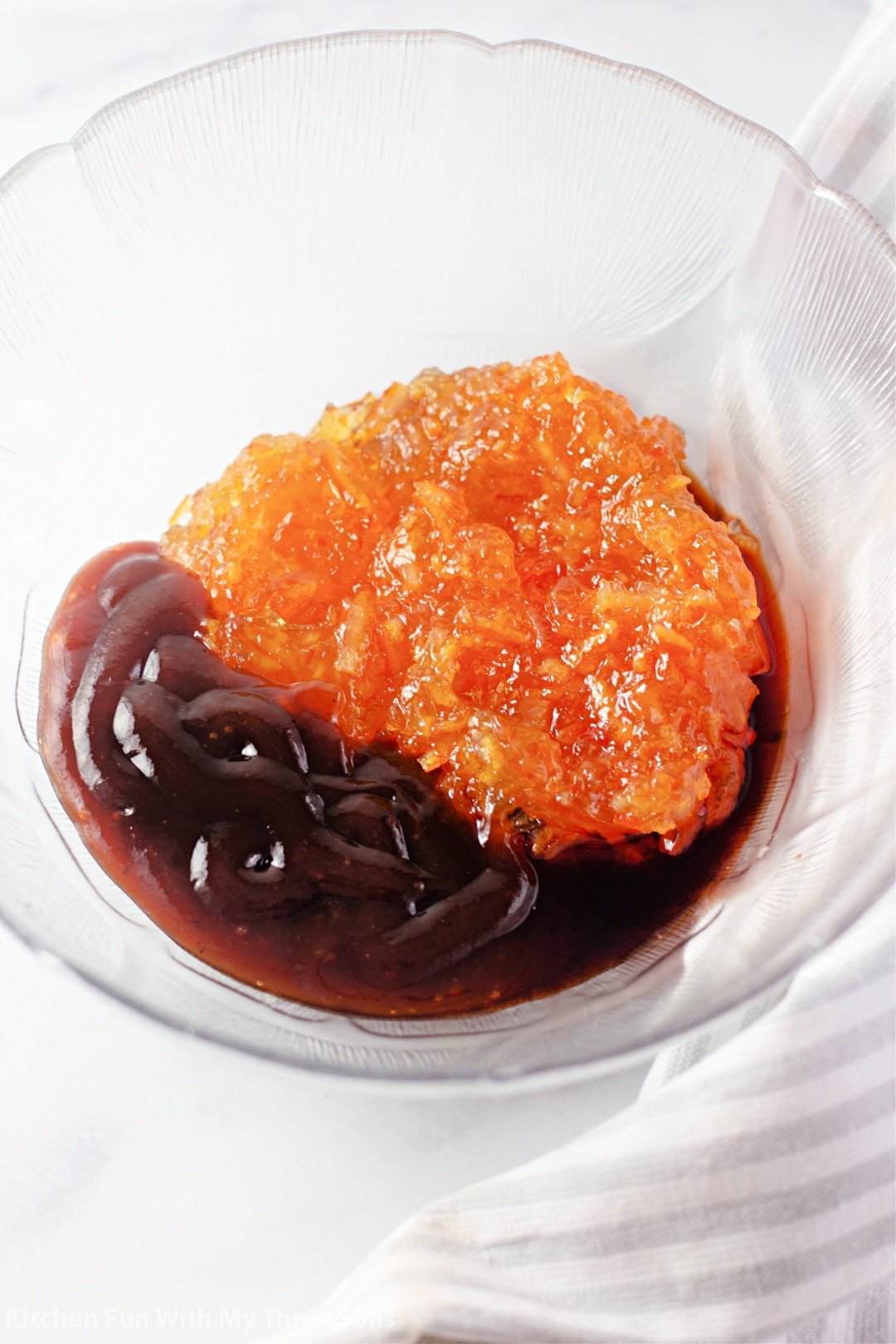 mixing up sauce in a clear bowl.