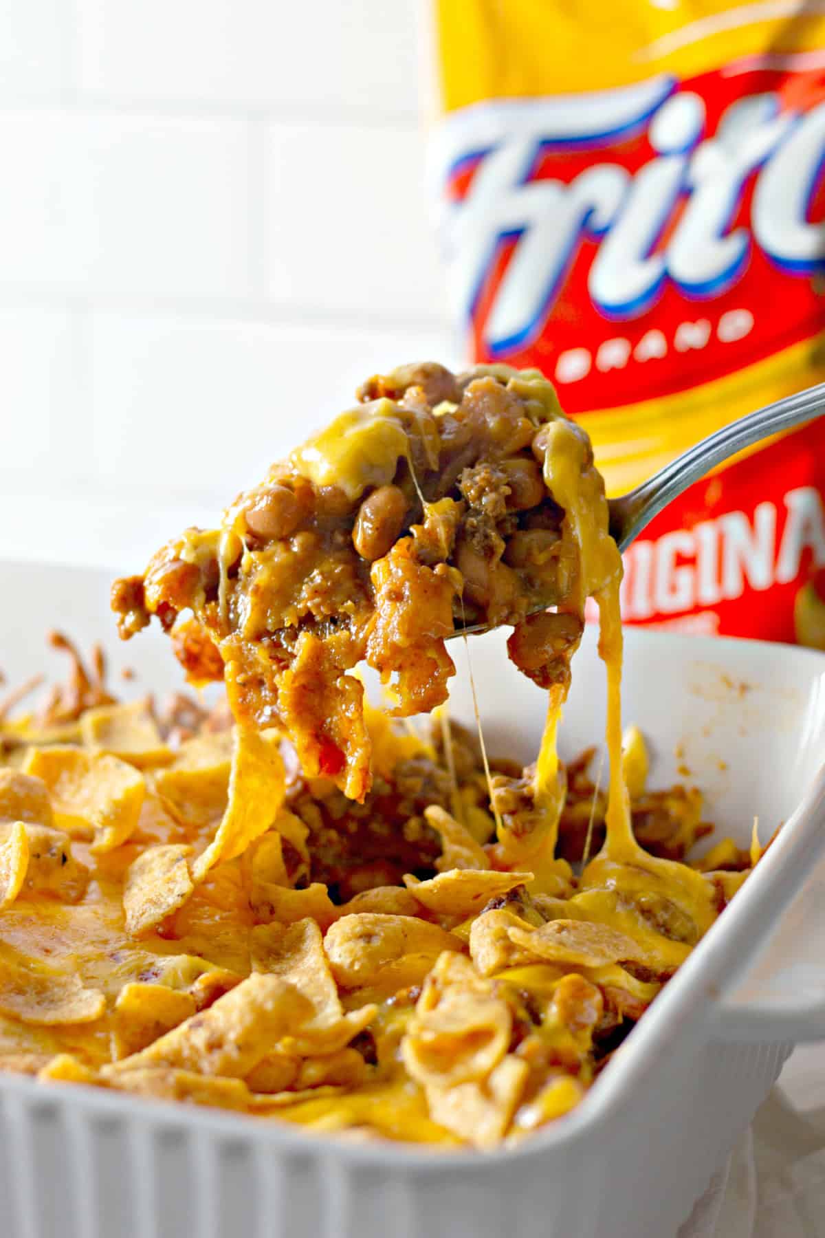 You'll love this Easy Frito Pie Recipe for a family-friendly dinner in a snap! Frito Pie with a spoon