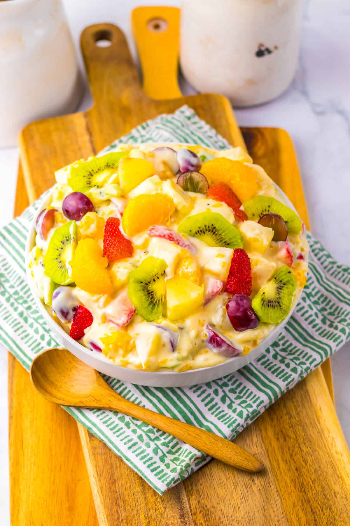 With a variety of fruit tossed in a creamy cheesecake base, this Hawaiian Cheesecake Salad is a tropical dessert perfect for summer. A bowl of Hawaiian cheesecake salad