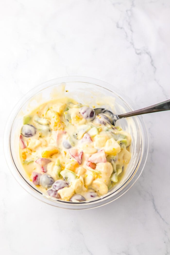 With a variety of fruit tossed in a creamy cheesecake base, this Hawaiian Cheesecake Salad is a tropical dessert perfect for summer. Mixing the cheesecake base into the bowl of fruit