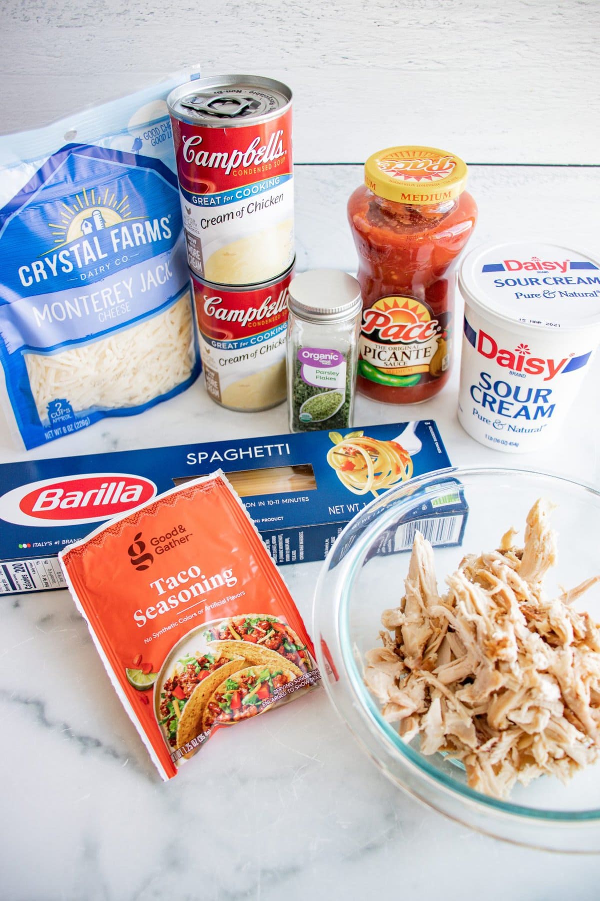 This Chicken Spaghetti Recipe is loaded with your favorite pasta flavors and uses pre-shredded or rotisserie chicken so you can have it on the table in no time. chicken spaghetti ingredients