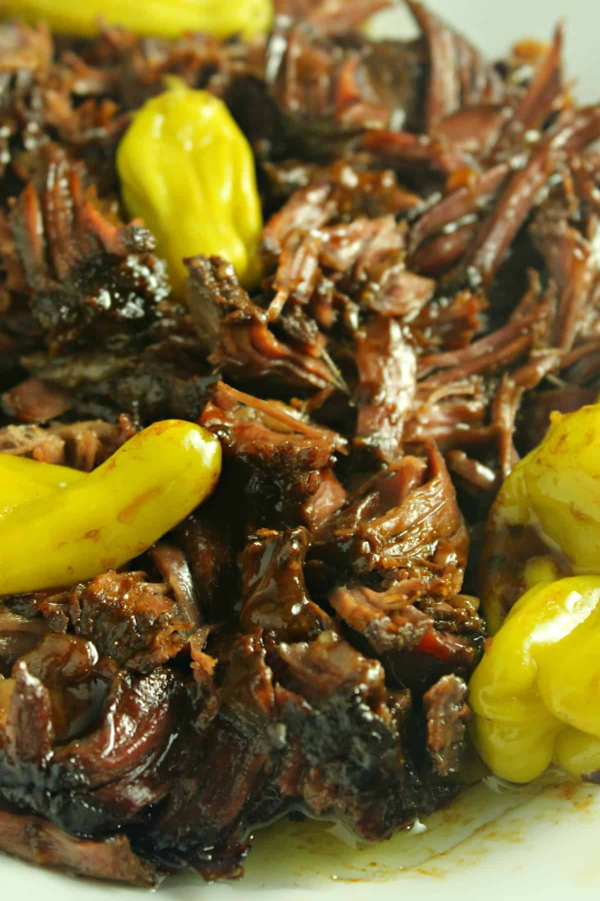 Mississippi Pot Roast is a flavor explosion of slow-cooked chuck roast, ranch seasoning, au jus seasoning, pepperoncini, and butter. Shredded Mississippi Pot Roast