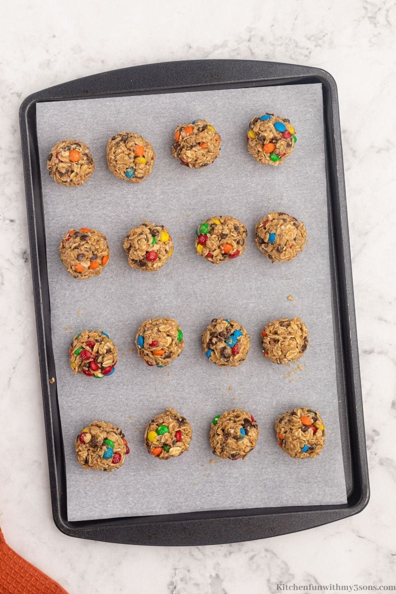 The balls of dough arranged on a cookie sheet.