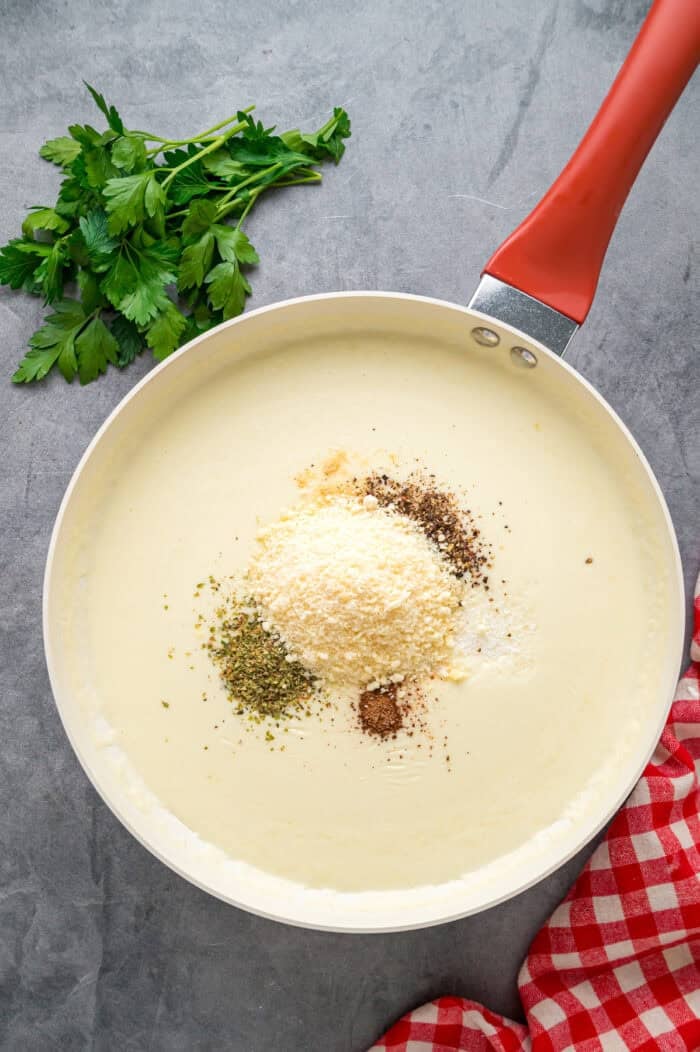 This Seafood Lasagna features layers of a creamy sauce infused with clam juice, noodles, and a shrimp and crab meat filling. Spices added to cream sauce