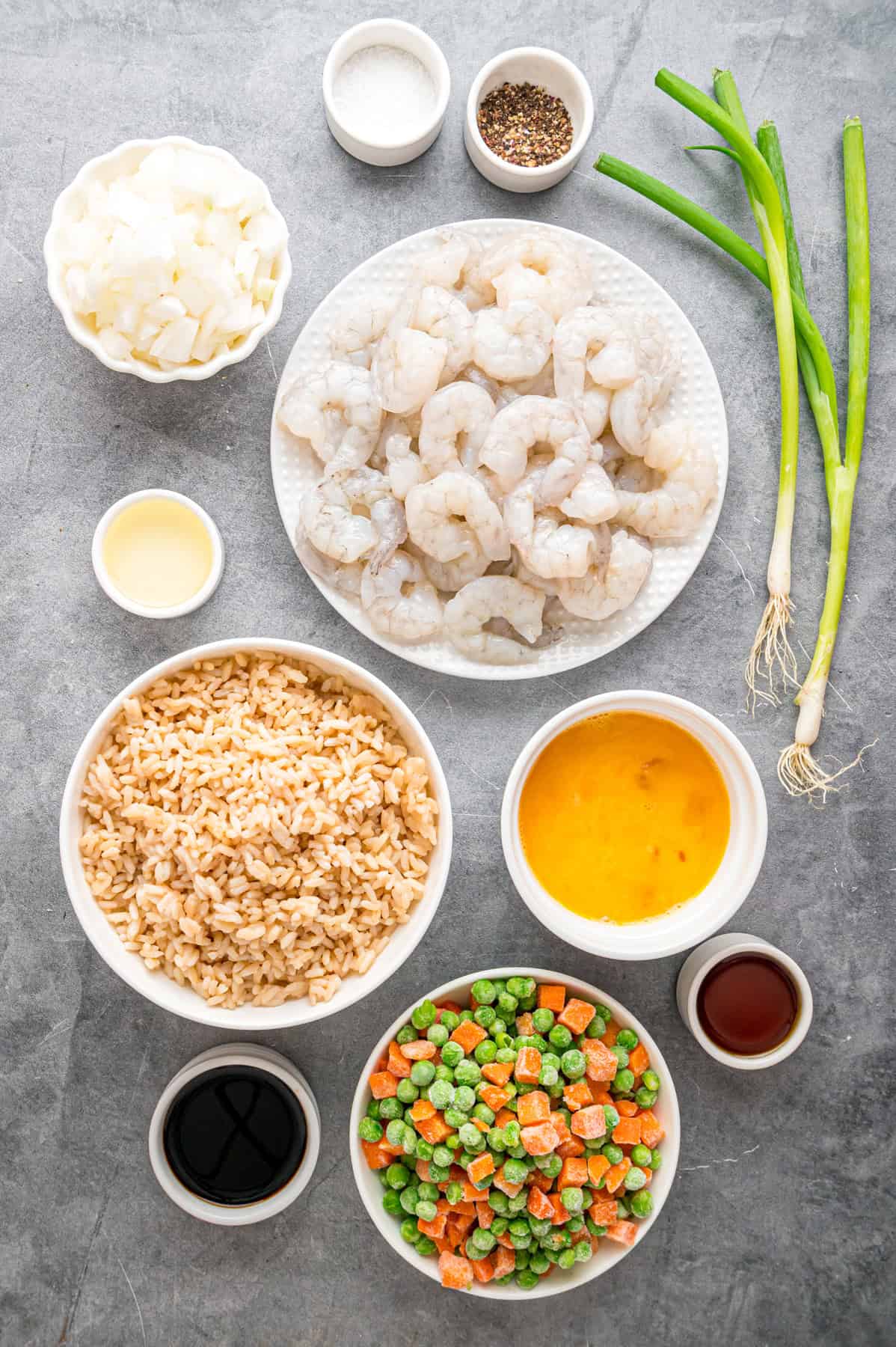 With juicy shrimp, veggies, and scrambled egg, this Shrimp Fried Rice recipe is better than takeout! Ready in just 30 minutes! Overhead view of ingredients needed to make shrimp fried rice